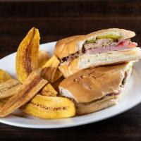 Sandwich Cubano · Our classic pressed sandwich made with our delicious slow-roasted pork, ham, pickles, Swiss ...