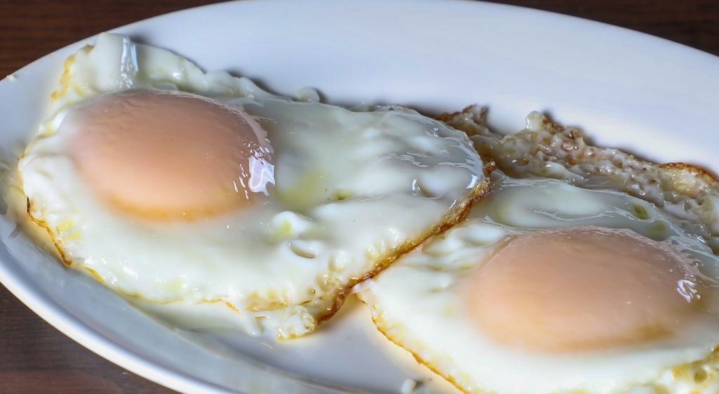 2 Huevos Fritos · 2 fried eggs.
