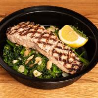 Grilled Salmon · Grilled Norwegian salmon served over sauteed broccoli rabe and
tuscan white beans.