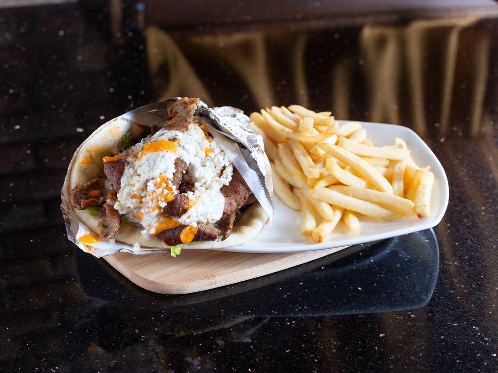 Gyro Wrap · Gyro meat (lamb and beef mixture), feta cheese, yogurt sauce and topped with spicy garlic sauce. Halal.