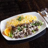 Lamb Shawerma Plate · Marinated lamb on a bed of lettuce, topped with tahini sauce. Served with basmati rice. Glut...