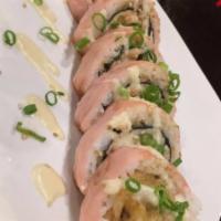 Tyler and Riley Roll · Maguro, salmon, hamachi, albacore and avocado tempura battered and fried. Rolled with rice a...