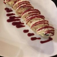 Wedashii's Crispii · Fresh fruit rolled in crispy rice and marshmallow cream roll with pastry cream and raspberry...
