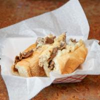 Philly Cheese Steak  · Shaved ribeye steak, mushrooms, green peppers, onions and American cheese.