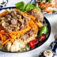 Authentic Uzbek Plov ( Available only on www.Farida.us) · Rice pilaf cooked in a kazan with chunks of beef, lamb, carrots and chickpeas, topped with s...