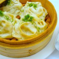 Hand Made Manti with Meat · 4 pieces. Steamed large dumplings stuffed with meat, onion and Asian spices. Served with sou...