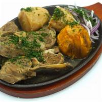 Authentic Kazan-Kebab · Fried baby lamb with chunks of fried organic idaho and sweet potato fried together in cast i...