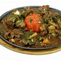 Lamb Stew with Tomatoes · Very tender baby lamb fillet and ribs stew with tomatoes.