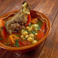 Ox Tail Stew · Slowly braised with chick peas, onions, topped with onions and herbs.