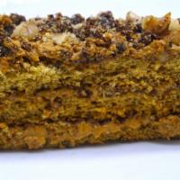Mom's Homemade Cake · Soft honey cake layered with caramel filling topped with walnuts.