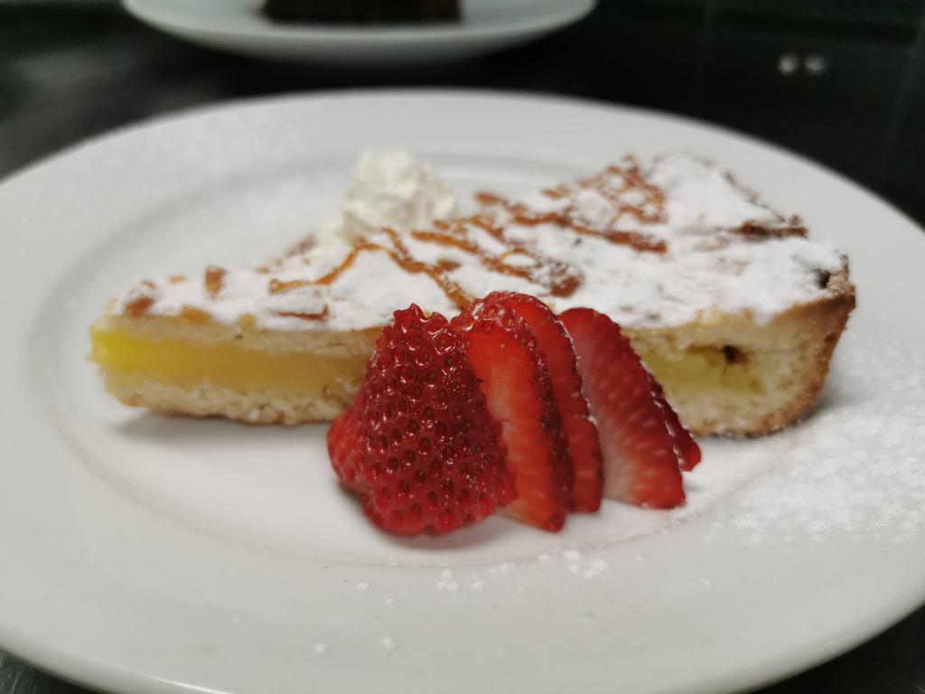 Lemon Tart · Filled with lemon cream and topped with rhubarb sauce.