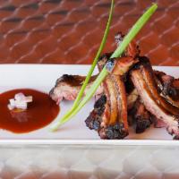 1/2 lb. Spare Ribs Platter · St. Louis cut pork spareribs served dry rubbed or honey BBQ glazed. Served with choice of tw...