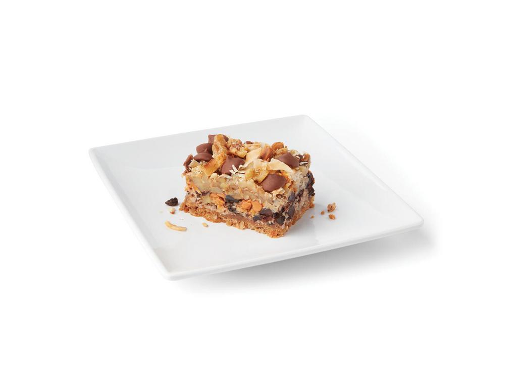 Million Dollar Bar · 7 layers of graham cracker crust, dark and milk chocolate, sweet toasted coconut, walnuts and butterscotch chips.
