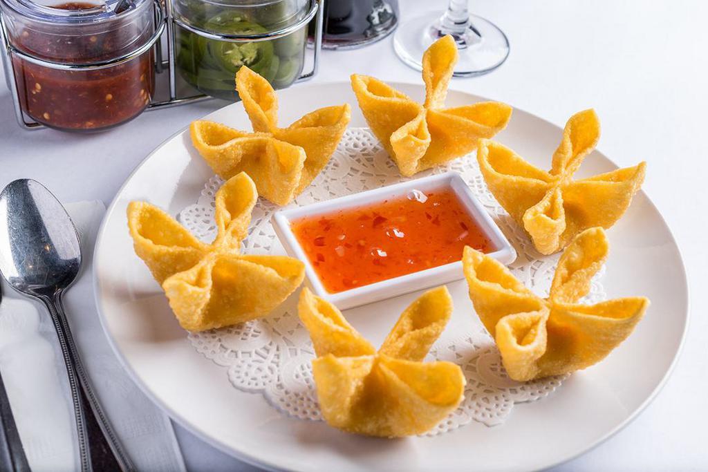 Crab Won Ton (6) · Crab Won Ton (6) Deep-fried wontons stuffed with imitation crab meat and cream cheese. Served with a sweet chili sauce