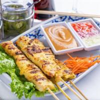 Chicken Satay (4) · Four skewers of grilled marinated chicken served with cucumber sauce and warm peanut sauce