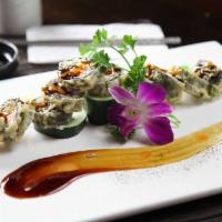 City Roll · Lightly fried roll with salmon, crabmeat, eel, avocado and cream cheese inside, splashed in ...