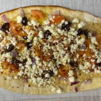 Mediterranean Hummus Pizza · House Hummus Spread, Kalamata Olive, Red Onion, Roma Tomato, goat cheese and spices on a 14x...