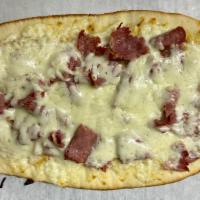 Corned Beef and Kraut Flat Bread Pizza · House Spicy Mustard Sauce, Sliced Corned Beef, Sauerkraut, cheese blend and spices on a 14x7...