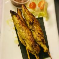 A5. Chicken Satay · Chicken skewers served with peanut sauce and cucumber sauce. Extra dipping sauce will be an ...