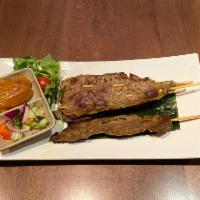 A5. Beef Satay · Beef skewers served with peanut sauce and cucumber sauce. Extra dipping sauce will be an +$1
