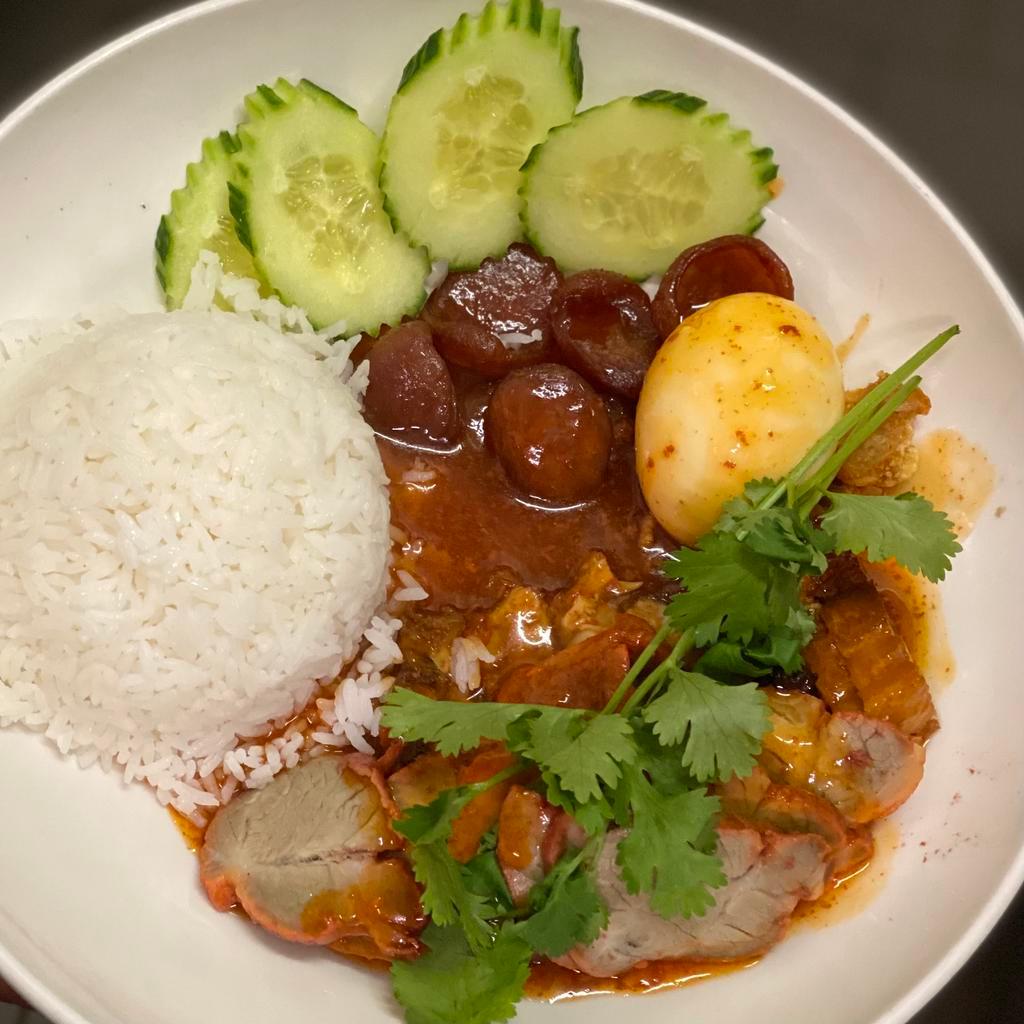R5. Kao Moo Dang · BBQ pork, crispy pork and Chinese sweet sausage topped with a homemade sweet sauce and served with a hard-boiled egg and a side of jasmine rice. *PLEASE NOTE: Can not be made spicy request hot sauce in sauces section.*