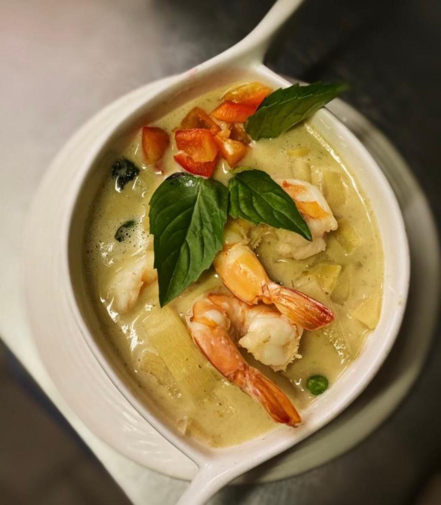 C1. Kang Curry · Choice of green or red curry with coconut milk, eggplant or
bamboo shoots, basil eaves, green peas and peppers. Hot and spicy. Served with rice. 
