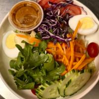 Y1. Thai Salad · Carrots, cucumbers, lettuce, red cabbage, tomatoes and a hard-boiled egg with homemade peanu...