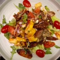 Y11. Roast Duck Salad · Roast duck salad mixed with cashew nuts, pineapples, tomatoes and Thai chili paste. Hot and ...