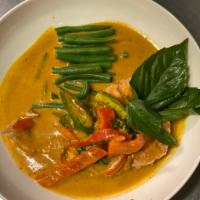 M4. Salmon Panang Curry · Fried salmon topped with panang curry, basil, peppers and string beans, served with jasmine ...
