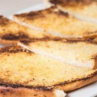 Garlic Bread · Toasted with garlic butter. Add dip for an additional charge.