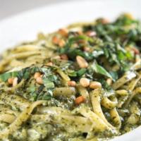 Linguine Pesto-Cream · Long, flat strands with a puree of basil, pine nuts, Parmesan, and olive oil and a splash of...