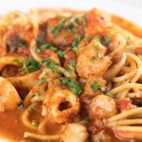 Spaghetti Frutti di Mare · Spaghetti with calamari, scallops, shrimp, and tomato-white wine sauce.