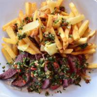 Chimichurri Steak Frites · Grilled flat iron, felipe's chimichurri, parmesan french fries.