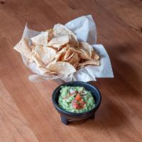 House-Smashed Guacamole · Tomatoes, red onion, cilantro and lime.