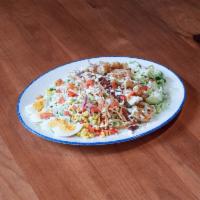 Cobb Salad · Crispy chicken tenders, bacon, romaine, bib, boiled egg, corn pico, habanero pickled red oni...