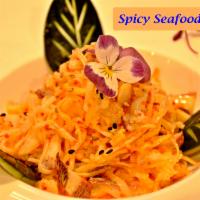 Spicy Seafood Salad · Crab meat, shrimp, octopus mixed with spicy mayo, placed on top of baby spinach. contains gl...