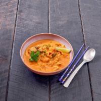 39. Panang Curry · Coconut milk, bell pepper, green peas and sweet basil.