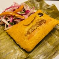 Chicken Tamales · Traditional Peruvian cornmeal patty with chicken and yellow pepper all wrapped in a plantain...