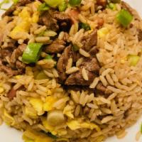Large Chaufa · Peruvian Style fried rice with scallions cilanitro and peppers seasoned with garlic ginger a...