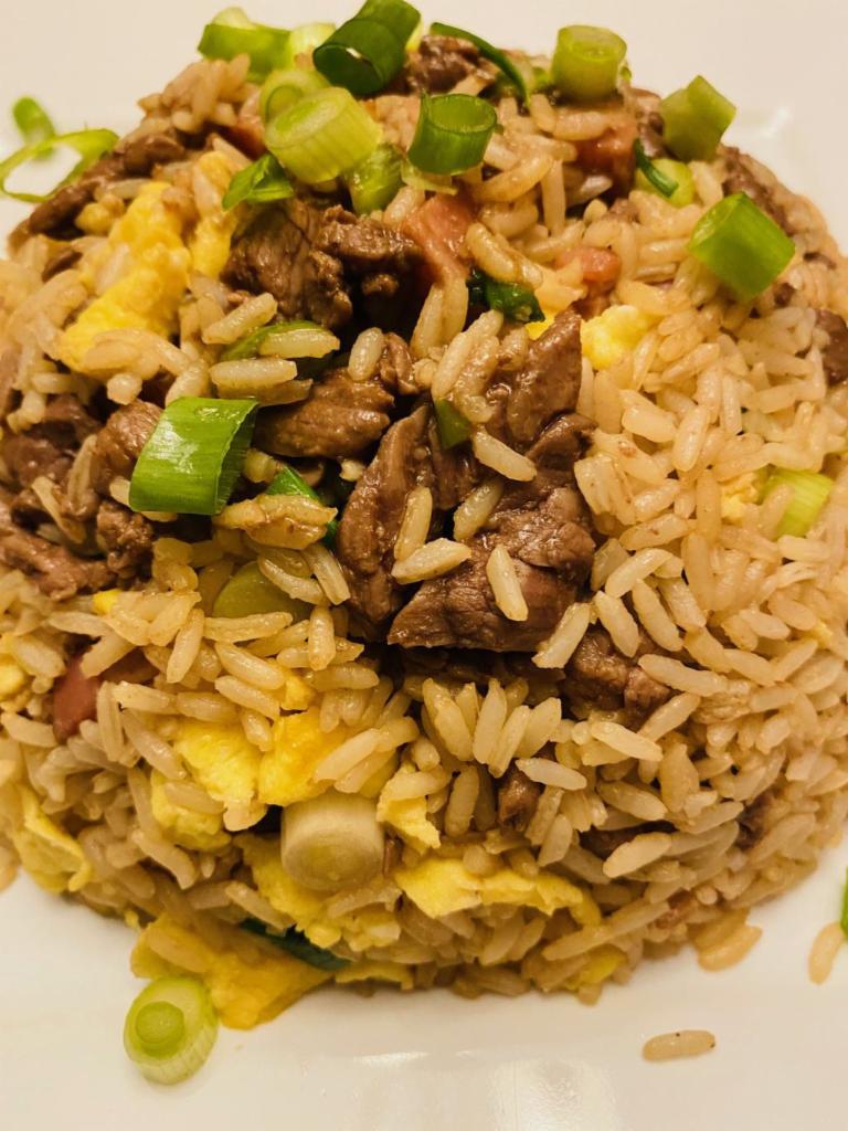 Large Chaufa · Peruvian Style fried rice with scallions cilanitro and peppers seasoned with garlic ginger and soy sauce