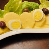 Papa a la Huancaina  · Sliced boiled potatoes smothered with a creamy yellow pepper sauce