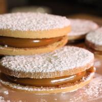 Alfajores  · Round shortbread cookie sandwich with Manjar blanco (dulce de Leche filling)