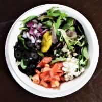 Greek Salad · Crisp romaine lettuce, black olives, feta cheese, red onions, tomatoes and pepperoncini.