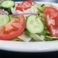 Garden Salad · Lettuce,Tomato,Cucumbers,onions  tossed with house or ranch dressing