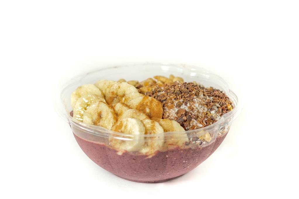 Soma · Blended: acai, almond butter, blueberries, banana, kale, orange juice / Topped with: granola, banana, cacao nibs, shredded coconut, cashews, mape syrup, cinnamon