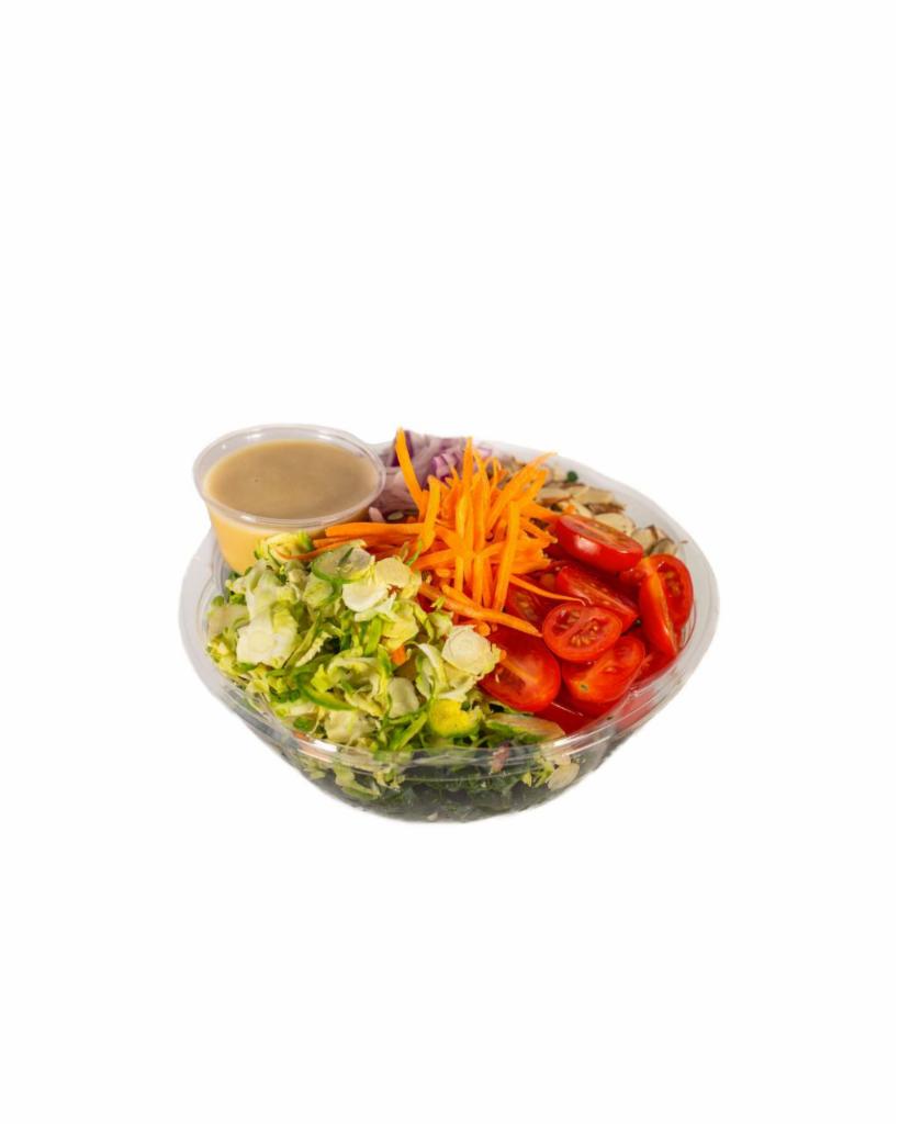 Shaved Brussels · shaved brussel sprouts, shredded kale, shaved carrots, diced roasted almonds, cherry tomato, red onion. Served with ACV Garlic dressing
