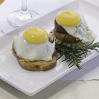 Sunrise Breakfast · 2 local organic eggs served sunny side up over Marin Sun Farm grass fed beef patties and gri...