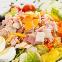 Cobb Salad · Chopped sliced turkey on a bed of lettuce with tomatoes, avocado, bleu cheese, chopped egg, ...