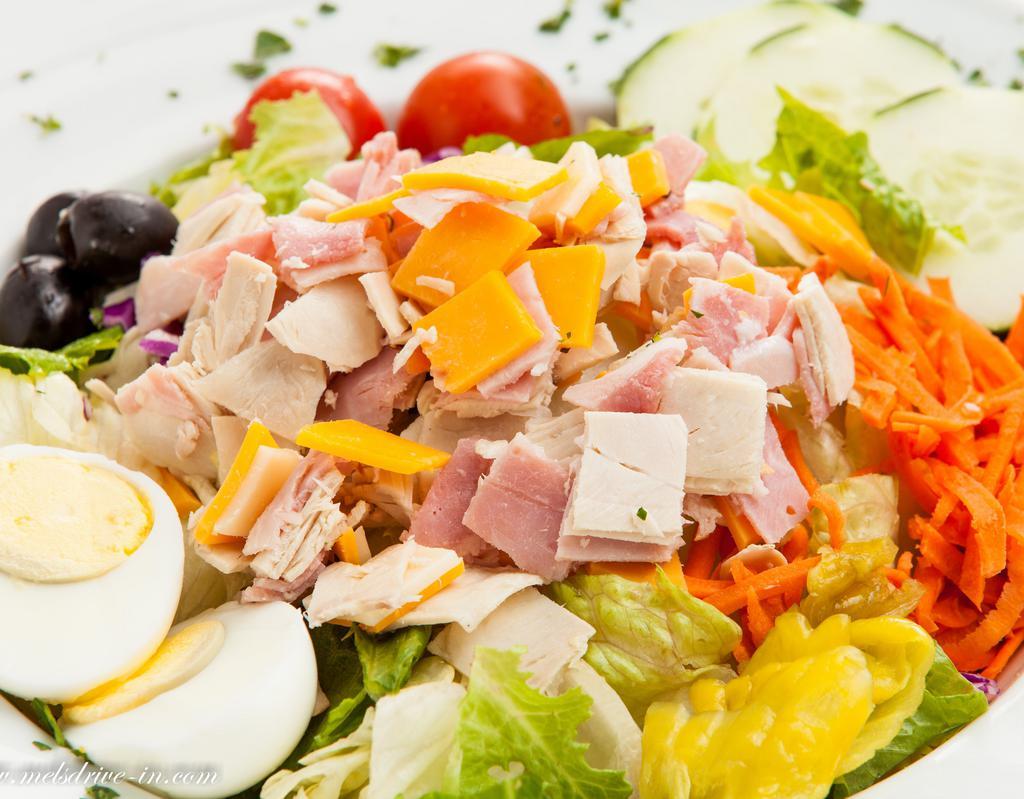 Cobb Salad · Chopped sliced turkey on a bed of lettuce with tomatoes, avocado, bleu cheese, chopped egg, carrots, black olives and Italian dressing. Gluten free.