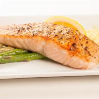 Grilled Fresh Atlantic Salmon Dinner · Served with grilled asparagus, rice pilaf, a roll and butter.
